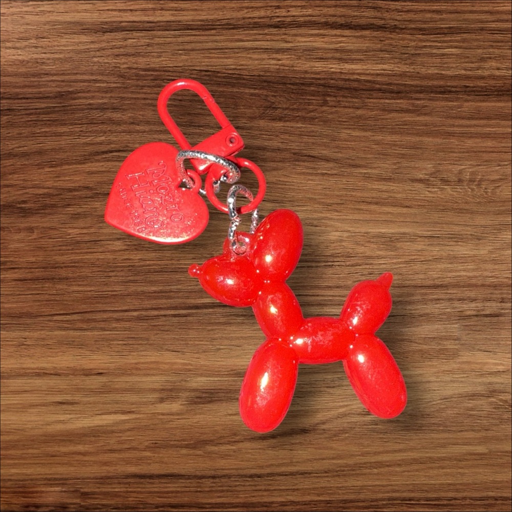 Bright Red Balloon Dog Keychain with Heart Charm.
